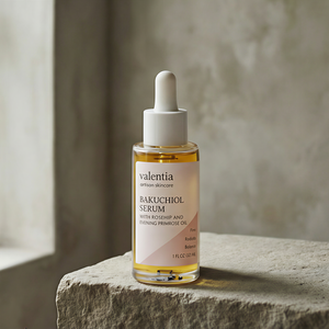Skincare serum bottle on a stone surface with a neutral background